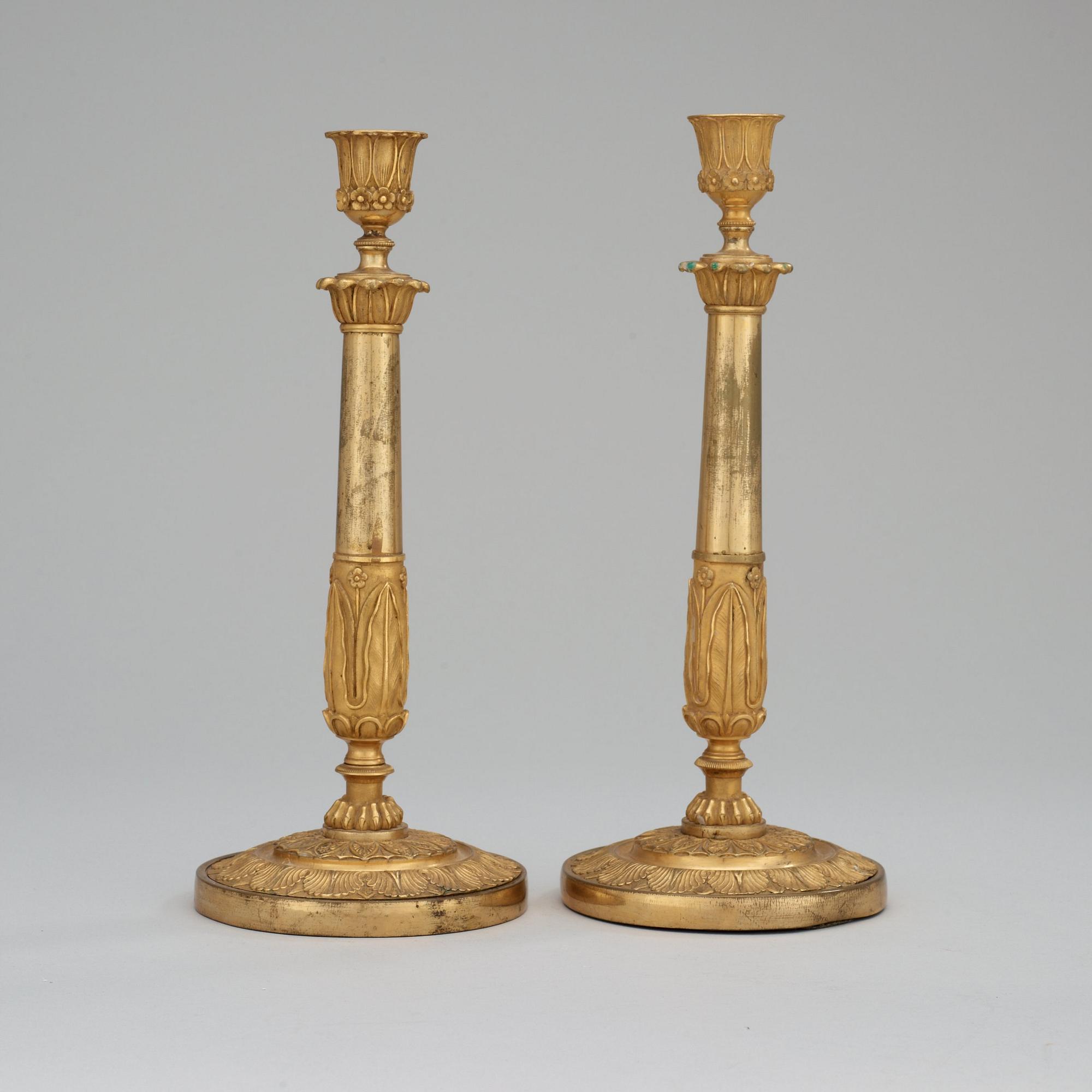 A pair of Empire early 19th century candlesticks.
