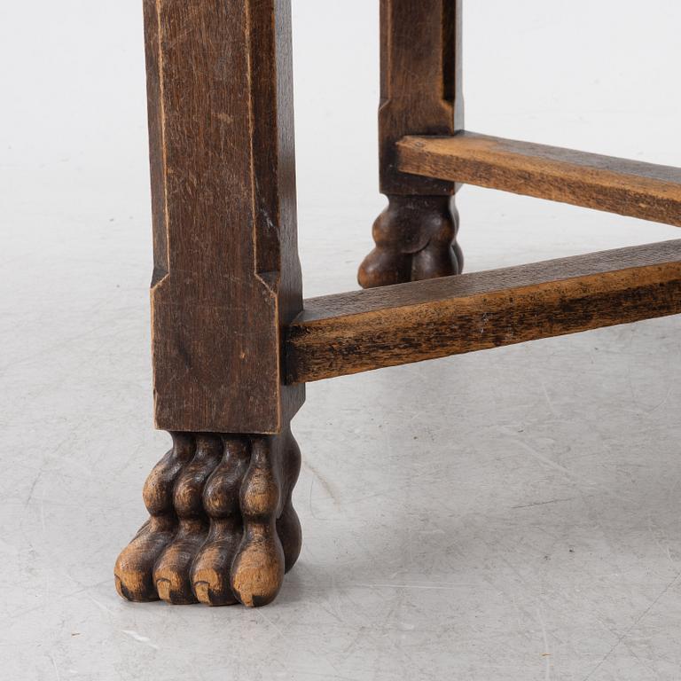 A Baroque-style dining table with six chairs, around 1900.