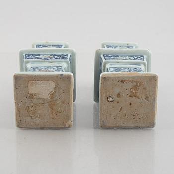 A pair of Chinese porcelain altar sticks, late Qing dynasty.