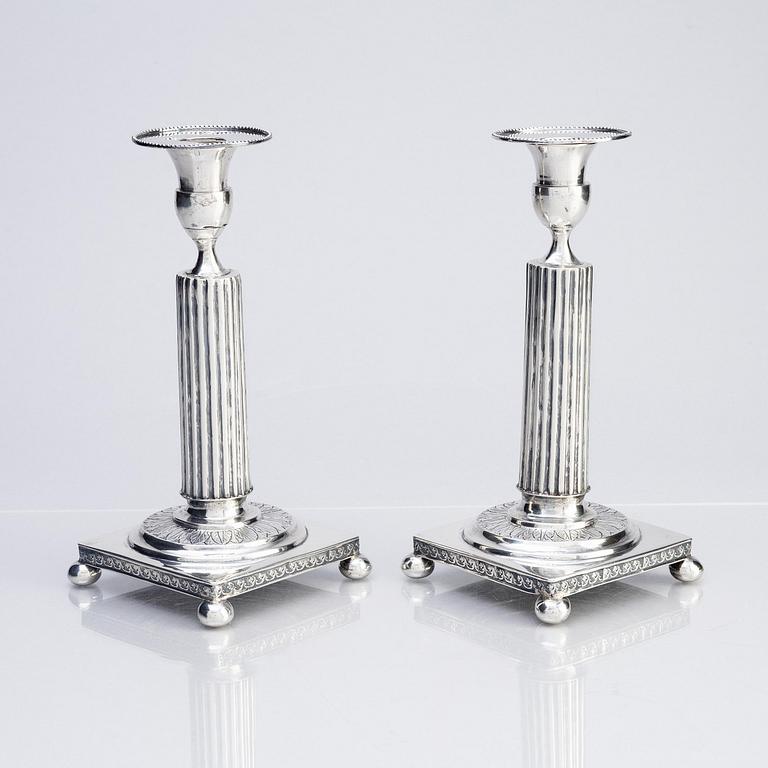 A pair of Gustavian silver candlesticks, unclear maker's mark, the cuffs with mark of Pehr Zethelius, Stockholm 1796.