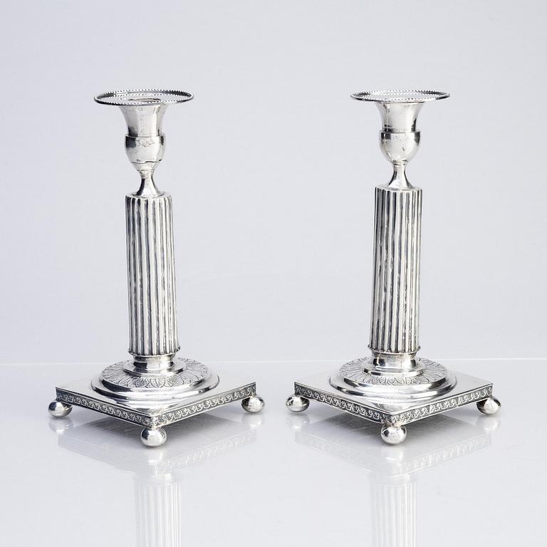 A pair of Gustavian silver candlesticks, unclear maker's mark, the cuffs with mark of Pehr Zethelius, Stockholm 1796.