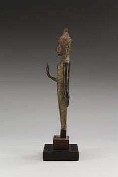 A slender bronze figure of Buddha, holding the left hand in Abhaya muddra, Thailand, 18/19th Century.