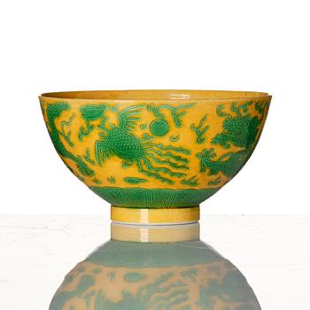 A yellow-ground green-enamelled 'dragon' and phoenix bowl, underglaze blue Daoguang seal mark and of the period.