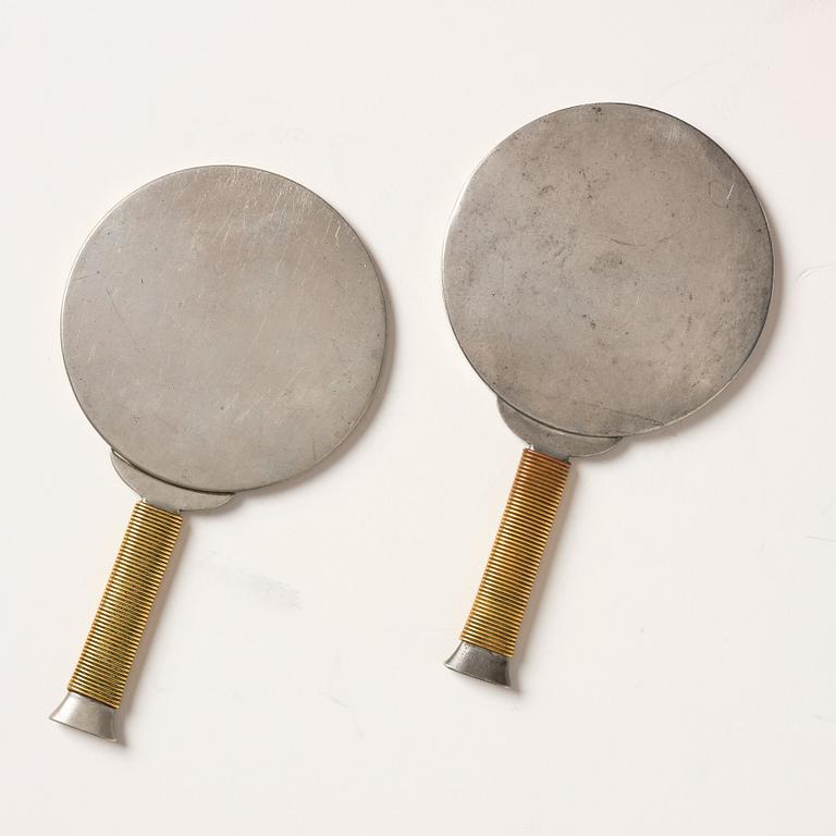Estrid Ericson, & Björn Trägårdh, a pair of pewter and brass hand mirrors model "A 1444", Firma Svenskt Tenn.