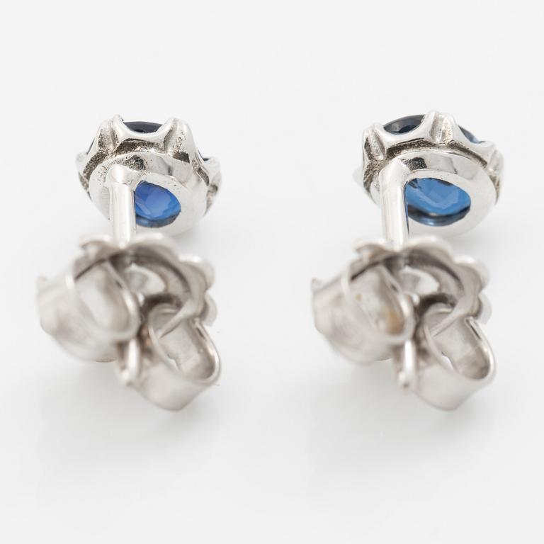 14K white gold earrings with faceted sapphires.