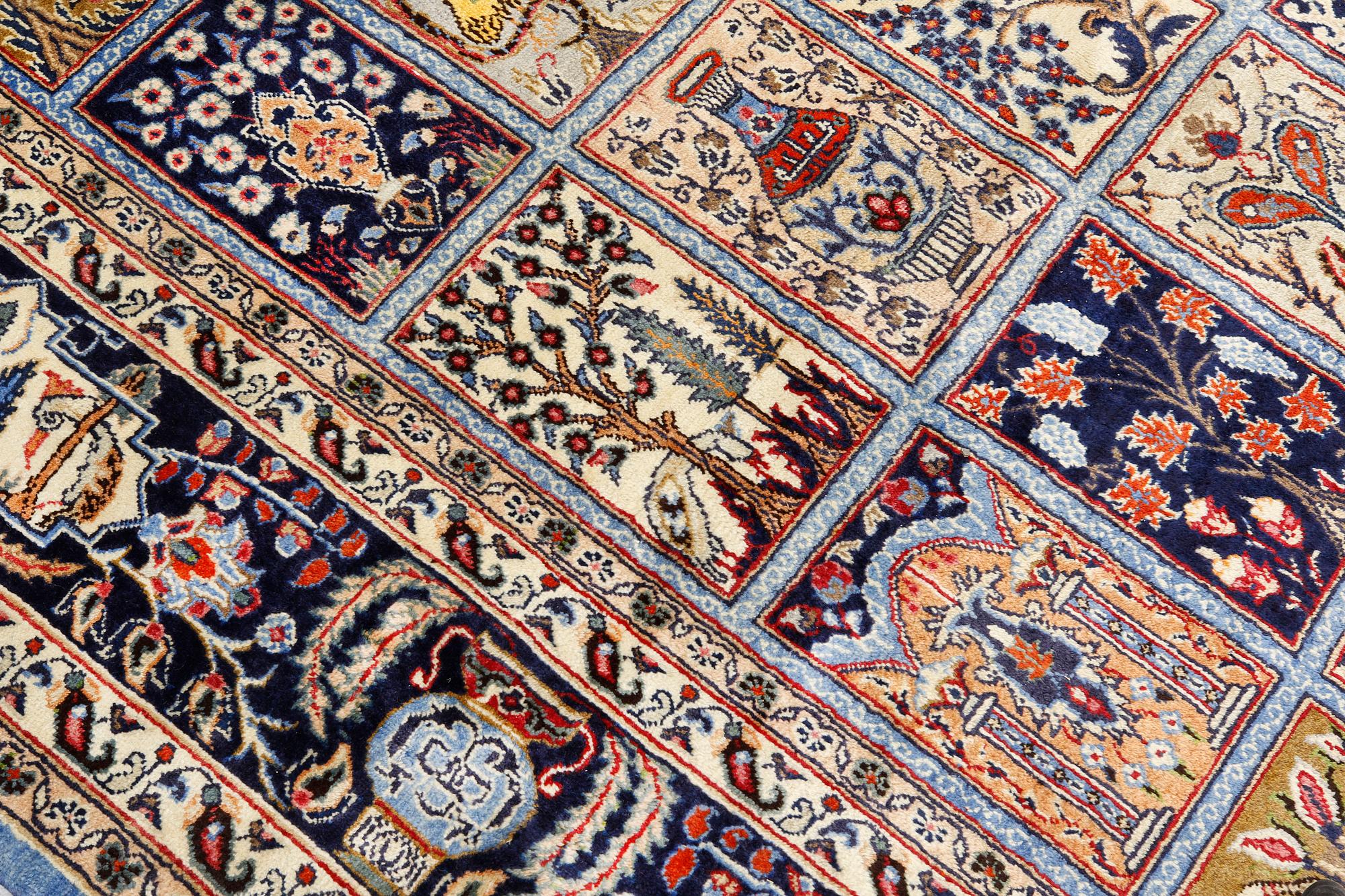 A Figural Sarouk carpet, c. 348 x 240 cm.