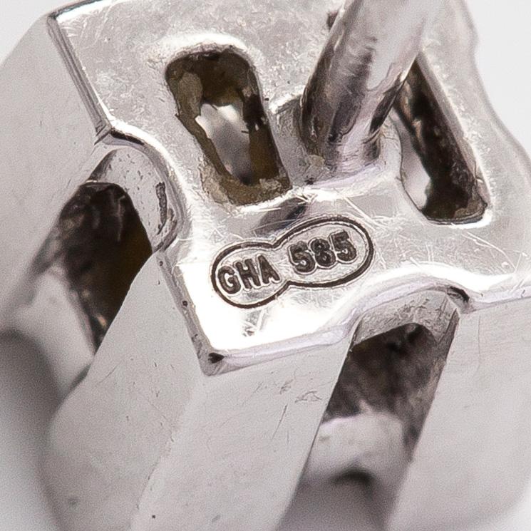 Korvakorupari, 14K valkokultaa sekä prinsesshiottuja timantteja yht n 0.08ct.