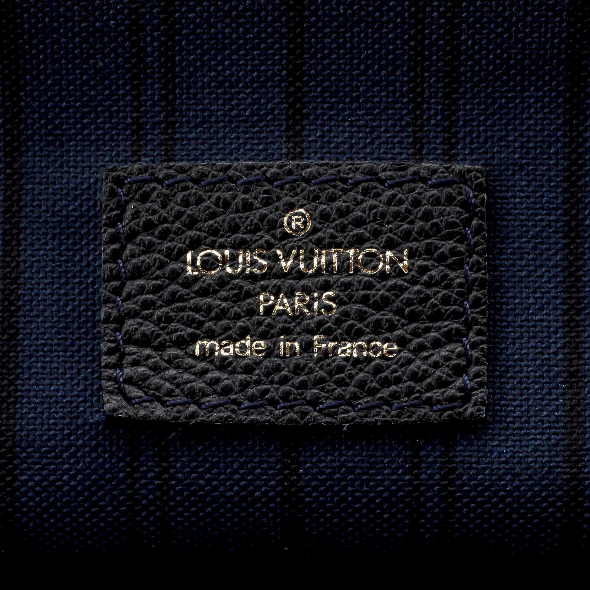 LOUIS VUITTON, a blue monogramed leather bag, "Monogram Empreinte Lumineuse".