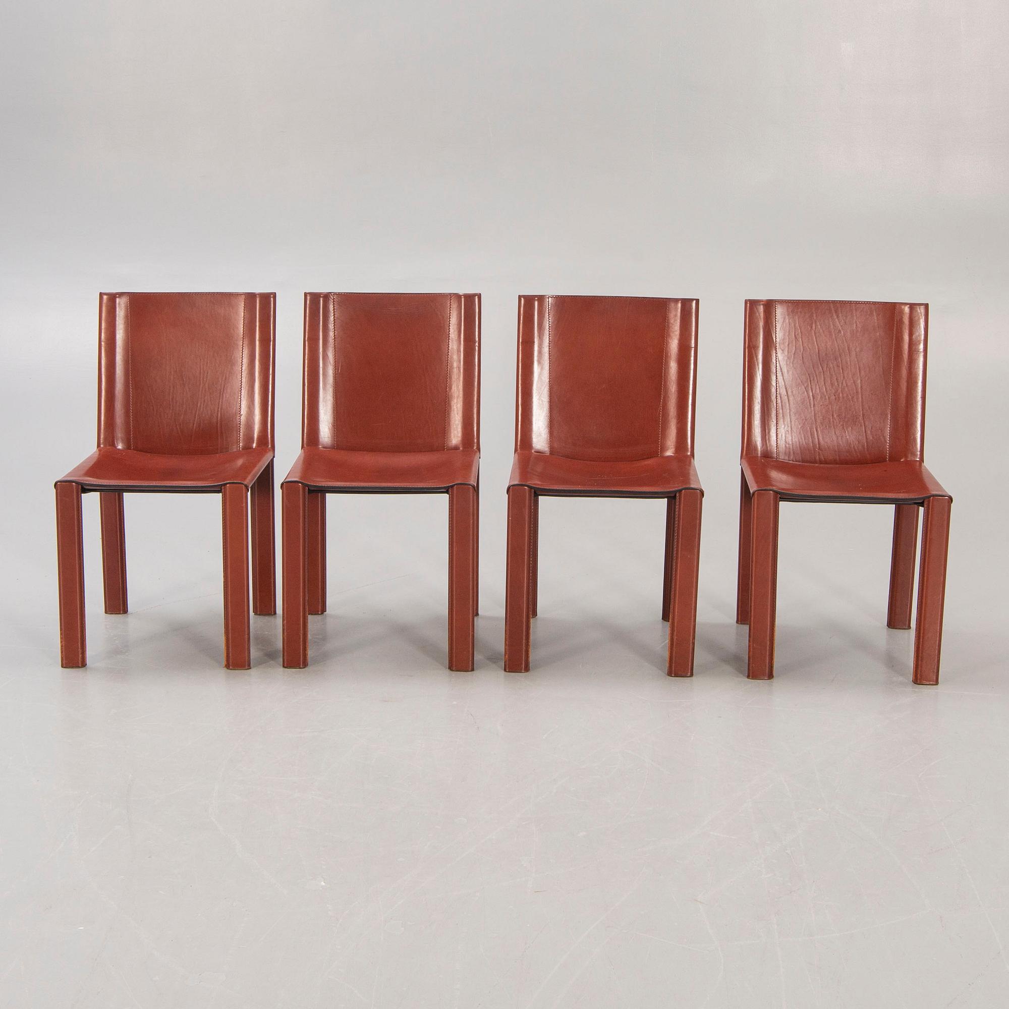 A set of four Matteo Grassi leather chairs alter part of the 20th century.