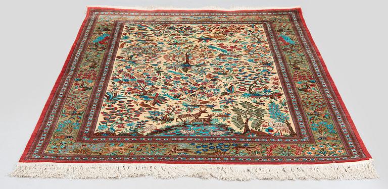 A silk Qum rug, central Persia, c. 210 x 138 cm.