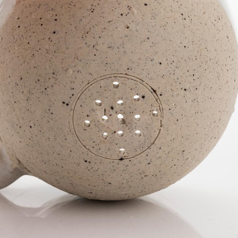 Kyllikki Salmenhaara, a stoneware tea strainer signed KS.