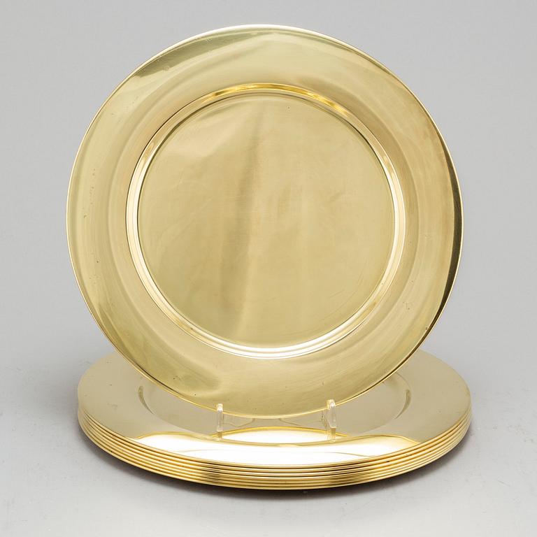 Eight brass plates by Stelton, Denmark, second half of the 20th century.