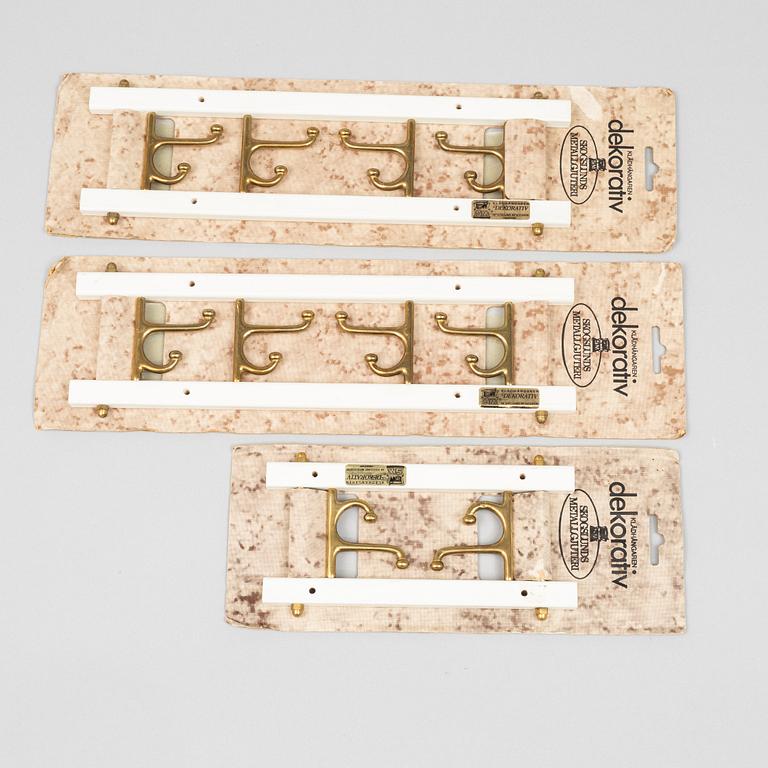 A set of three 'Dekorativ' coat hangers, Skoglunds metallgjuteri, Anderstorp, second half of the 20th century.