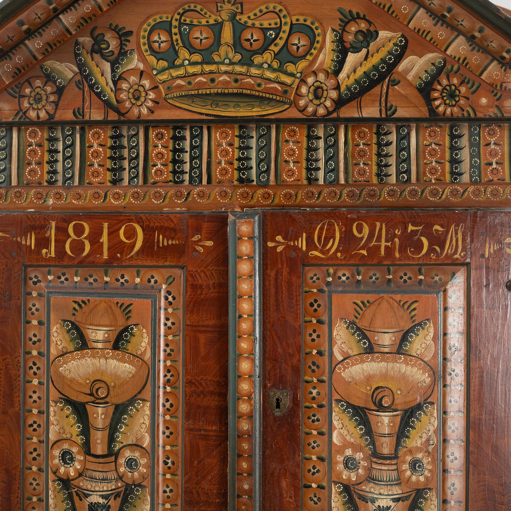 A Swedish traditional painted cabinet, dated 1819.