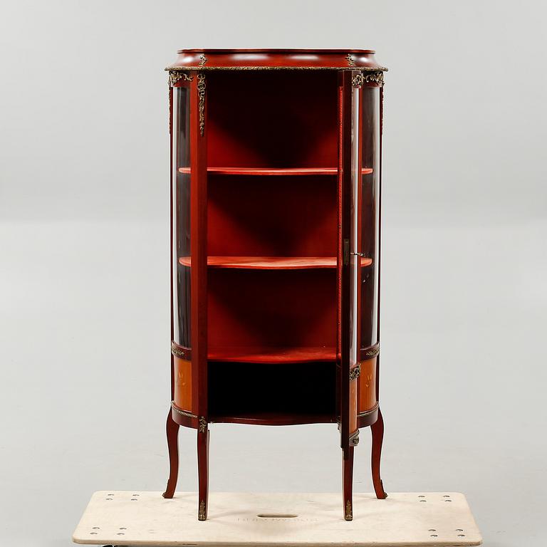 A mid 20th century glass cabinet.