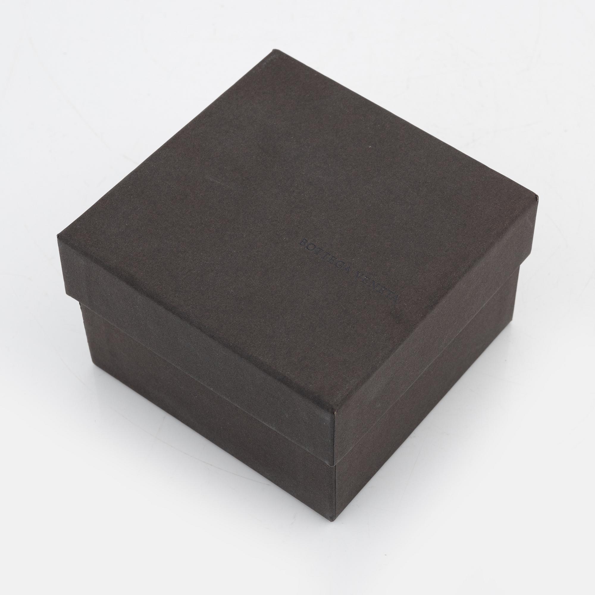 Bottega veneta, a leather and silver bangle.