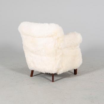 A 1940/50s cheep skin armchair.