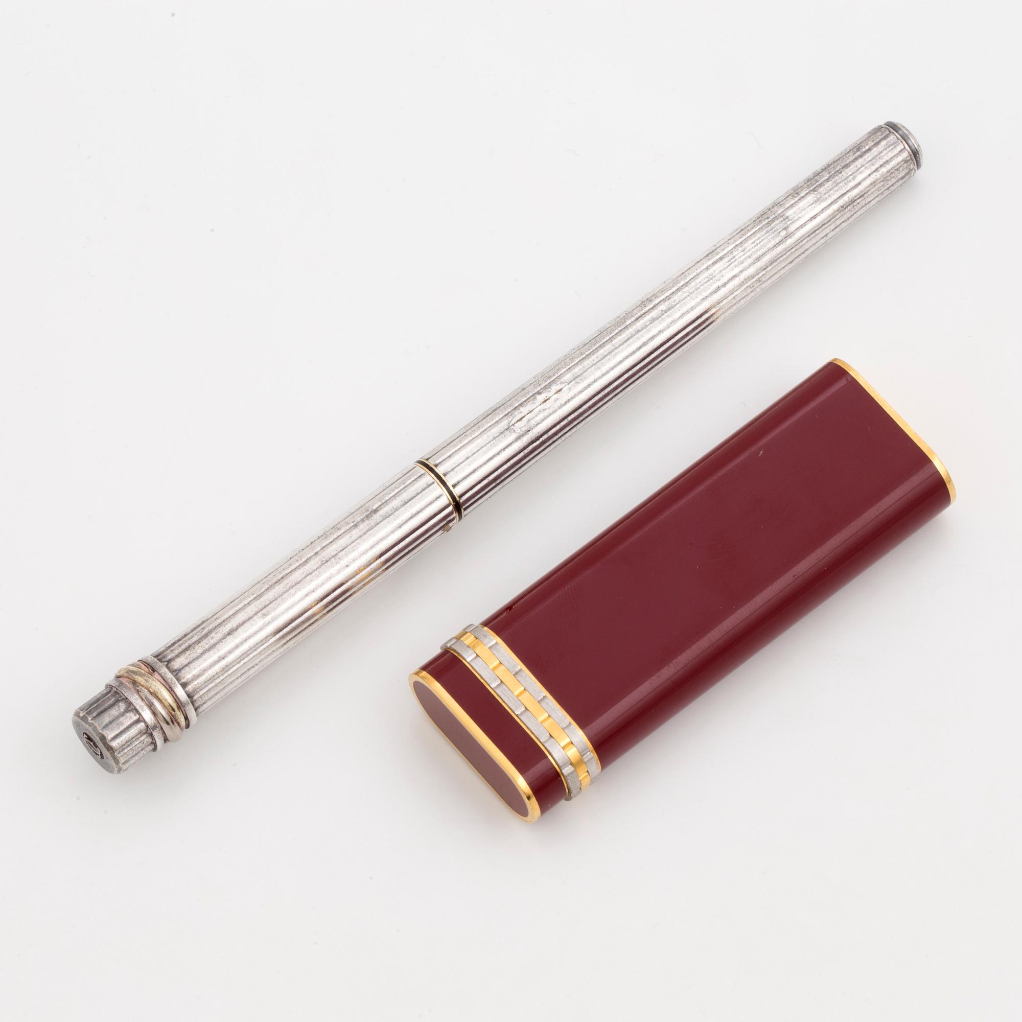 A Cartier lighter and pen.