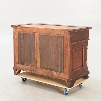 An early 1900s mahogany display cabinet.