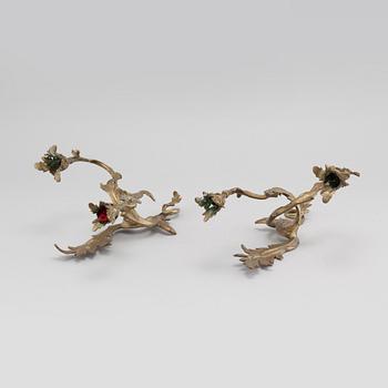 A pair of Louis XV-style brass wall sconces first half of the 20th century.