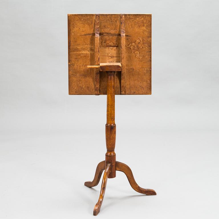 A tilt-top tripod table,  first half of the 19th century.