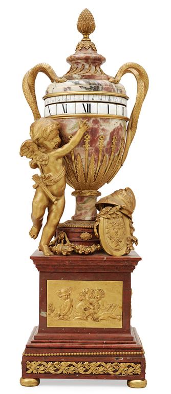 A Louis XVI-style late 19th century gilt bronze and marble vase clock "Pendule à cercles tournants", Dufaud Paris.