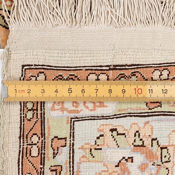 An oriental, silk rug, signed, c. 175 x 125 cm.