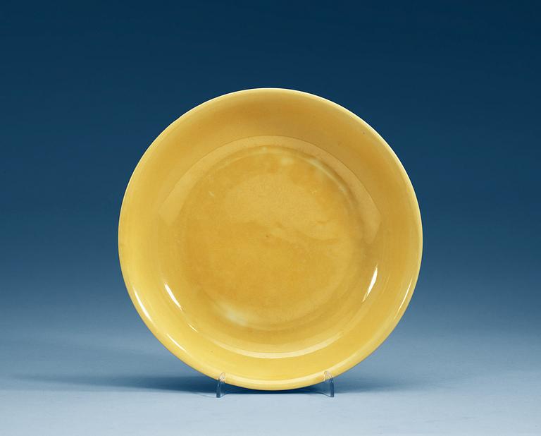 A Yellow glazed dish, Ming dynasty with Jiajings six character mark and period (1521-1567).