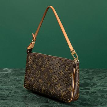 A CLUTCH by Louis Vuitton.