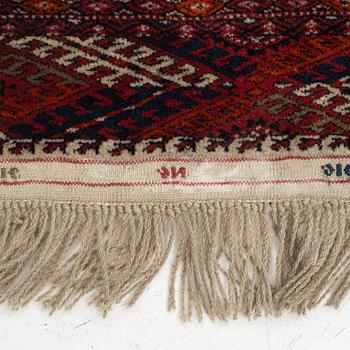 An oriental rug, c. 184 (+4cm flat weave on each end) x 133 cm.