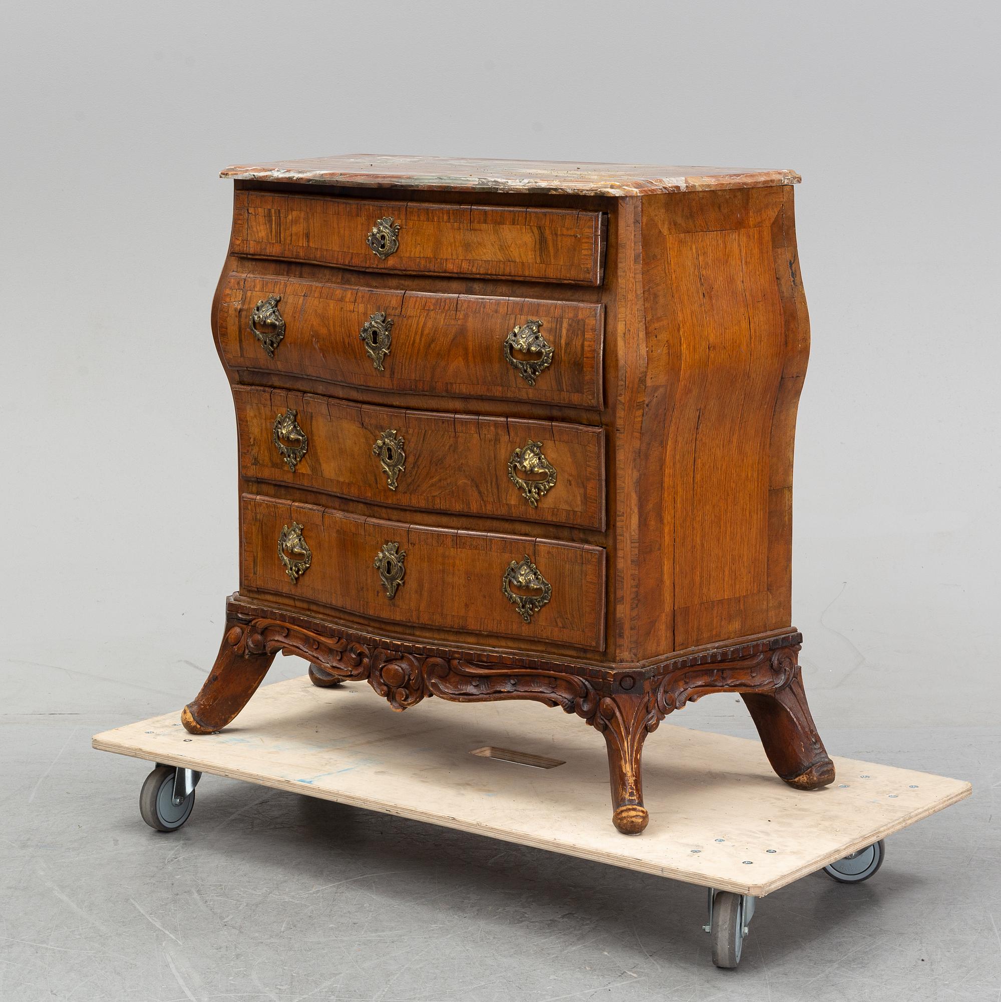 A 19th Century rococo style chest of drawers.