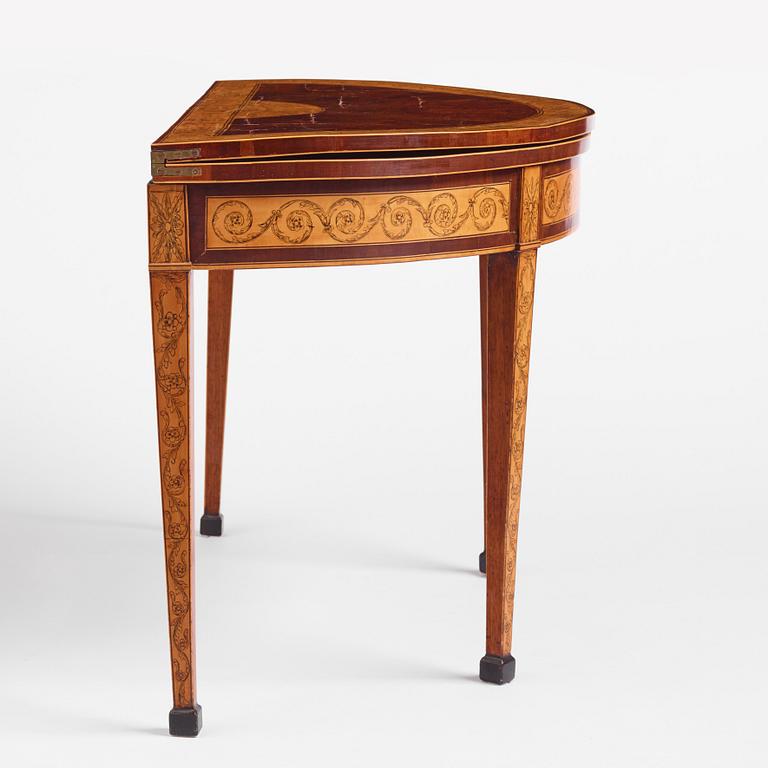A Russian Louis XVI mahogany and birch parquetry demi-lune games table, late 18th century.