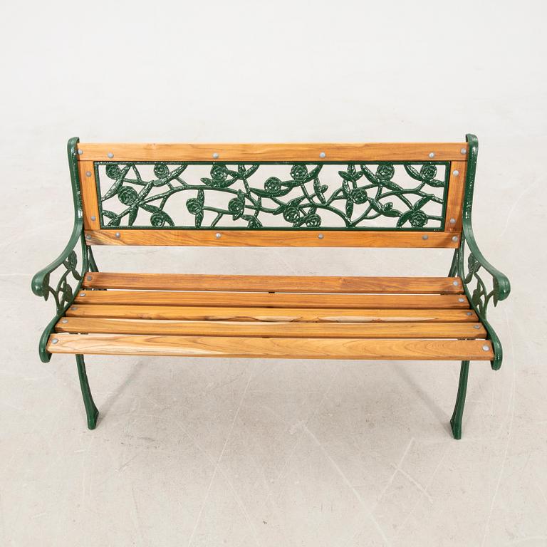 Garden sofa and parasol stand, late 20th century.