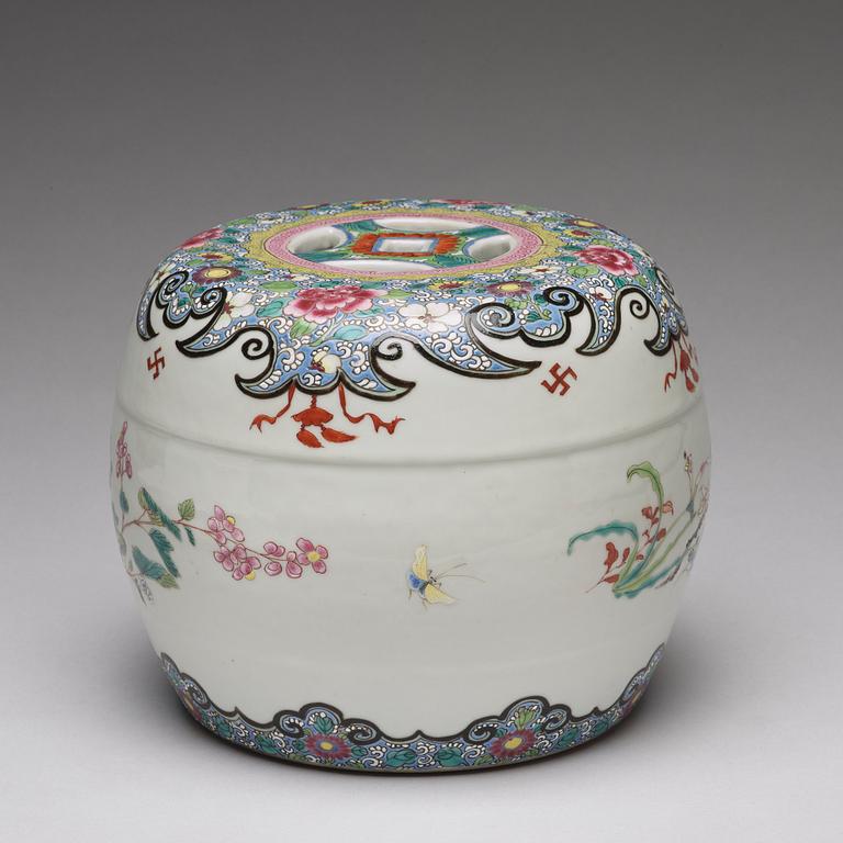 A small famille rose garden seat/stand, Qing dynasty, circa 1900.