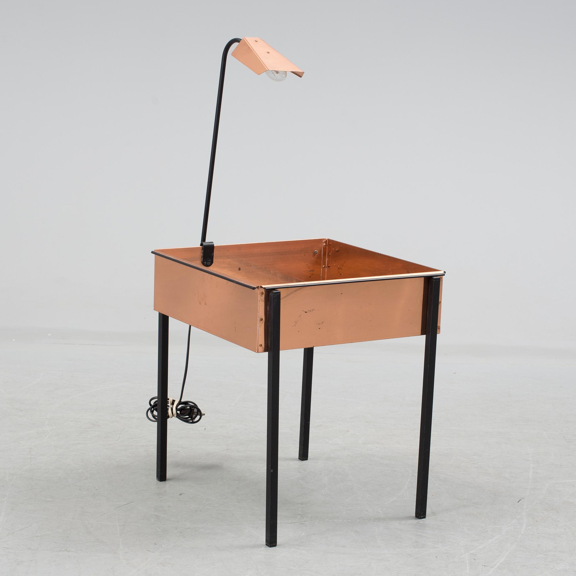 a flower table with a light by Gnosjö konstsmide in the second half of the 20th century.