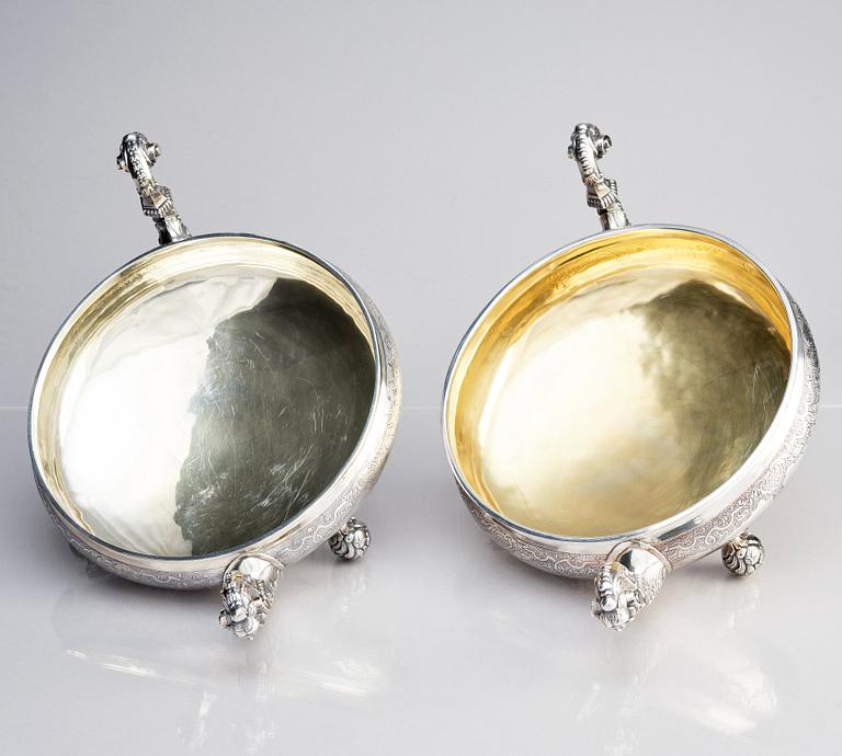 A pair of Swedish parcel-gilt silver bowls with covers, mark of S.A.Ackland, 1953 and 1963.