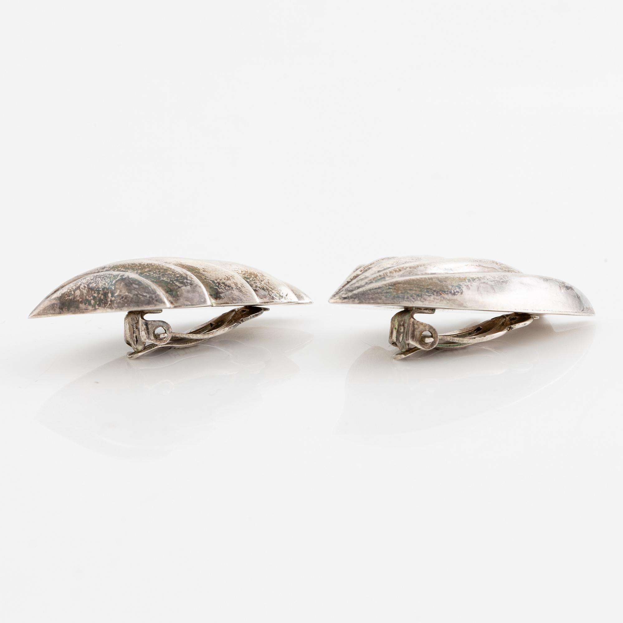 Earrings, silver, in the form of stylised leaves.