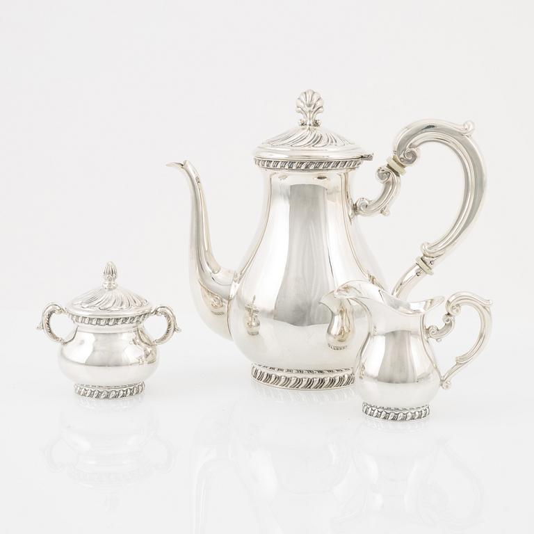 A three-piece rococo style silver coffee service, Swedish import marks by MEMA.