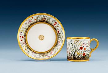 1257. A French Empire cup with saucer, by Dihl.