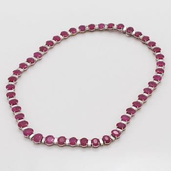 A ruby and baguette cut diamond rivière necklace by Demner New York. Total carat weight of diamonds circa 9.00 cts.