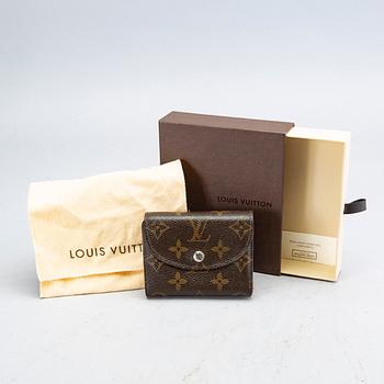 An 'Helene' wallet by Louis Vuitton.