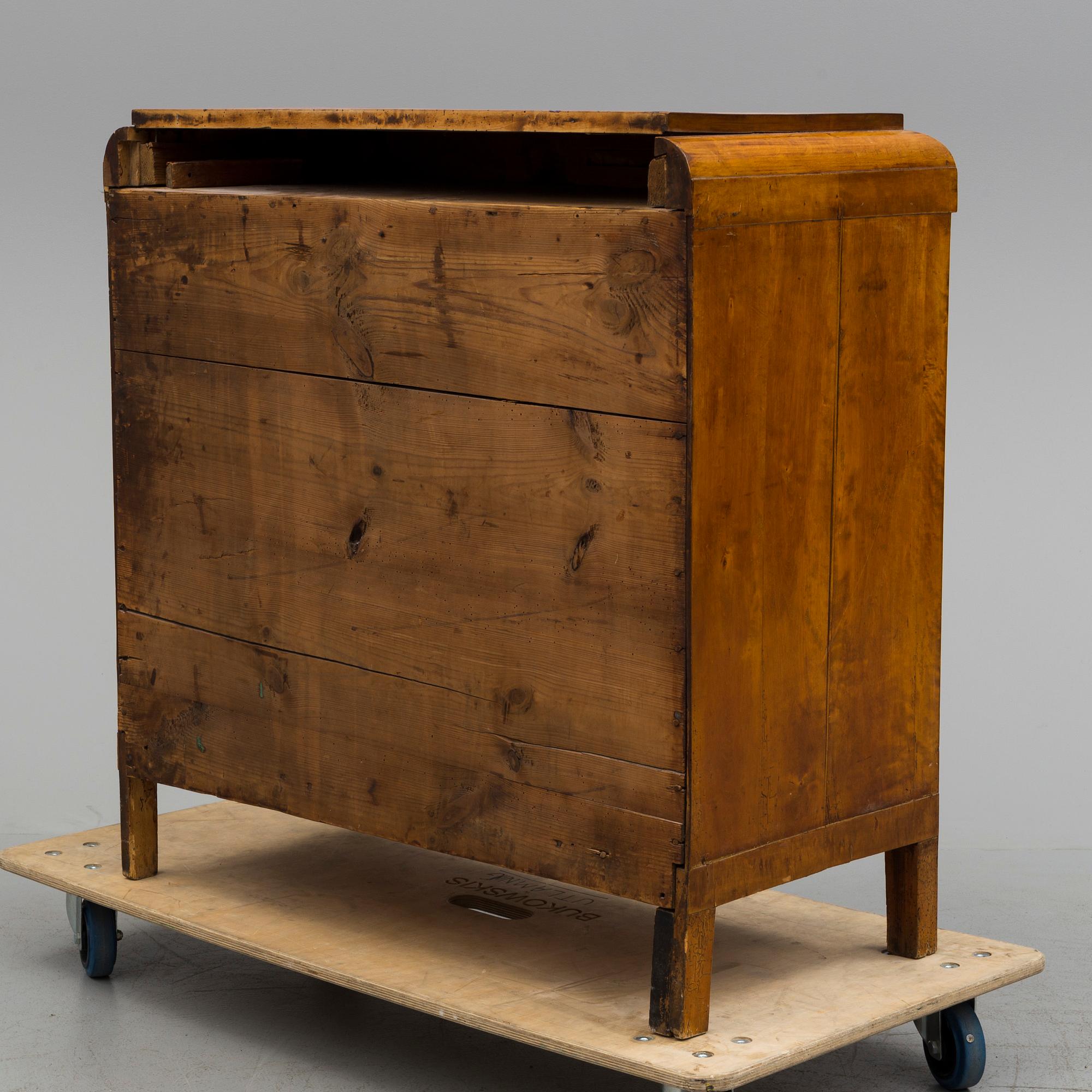 A mid 19th century chest of drawers veneered with birch.