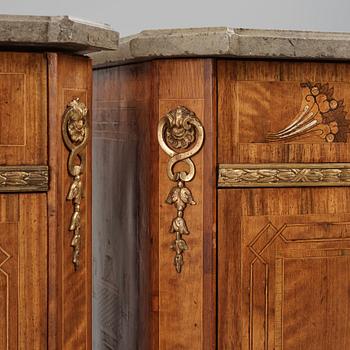 A matched pair of Gustavian ormolu-mounted limestone topped and marquetry commodes by C. Lindborg, late 18th century.