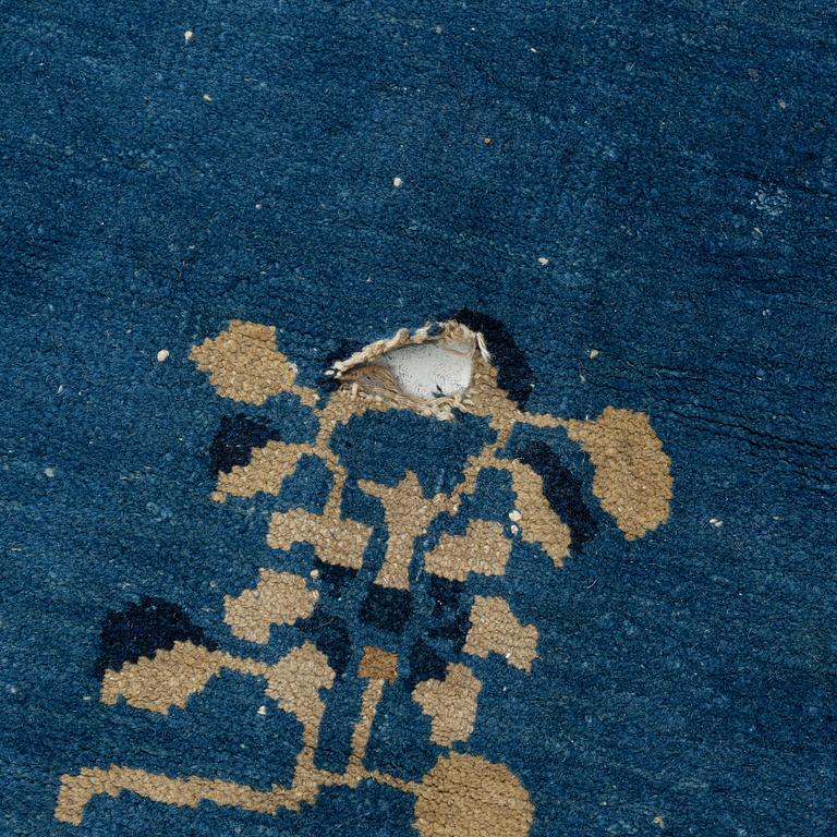 An antique Chinese carpet, c. 355 x 270 cm.