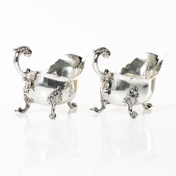 A pair of 18th century silver sauce boats, Richard William, Ireland, spoons, Peter & William Bateman, London 1807.