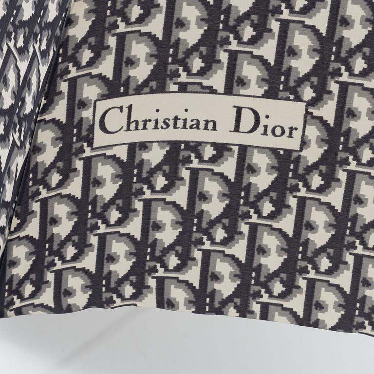 Christian Dior, a black canvas umbrella, toilet bag, coin purse and wallet.