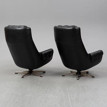A pair of leather wivel chairs from PeeM, Finland, 1970's.