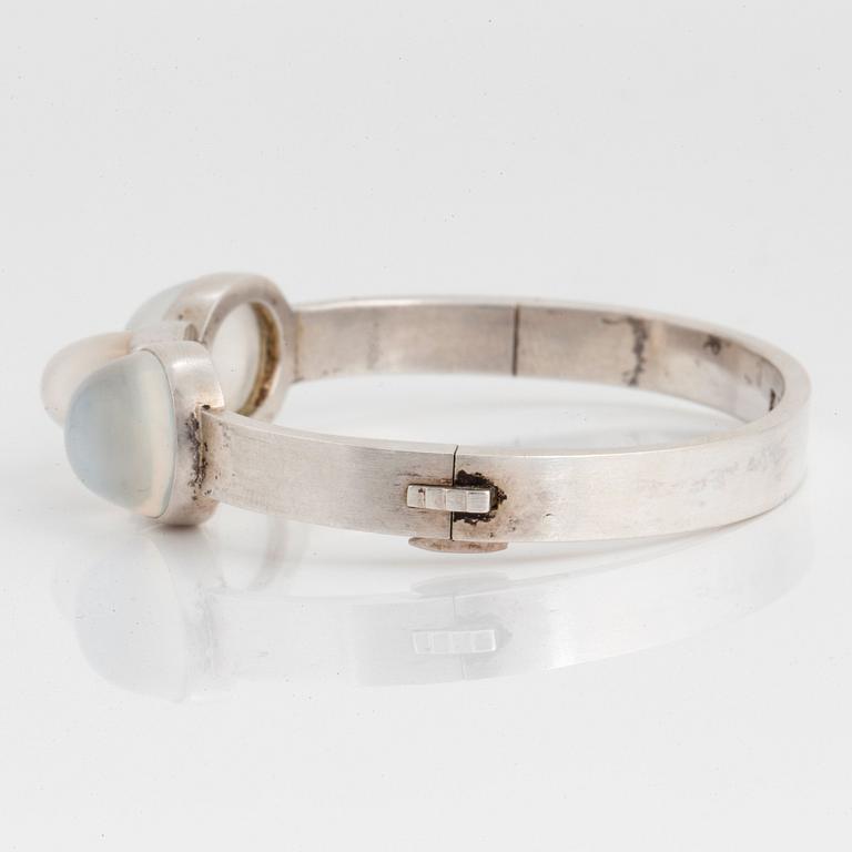 Wiwen Nilsson, a sterling silver bangle with three cabochon cut moonstones, Lund, Sweden 1938.