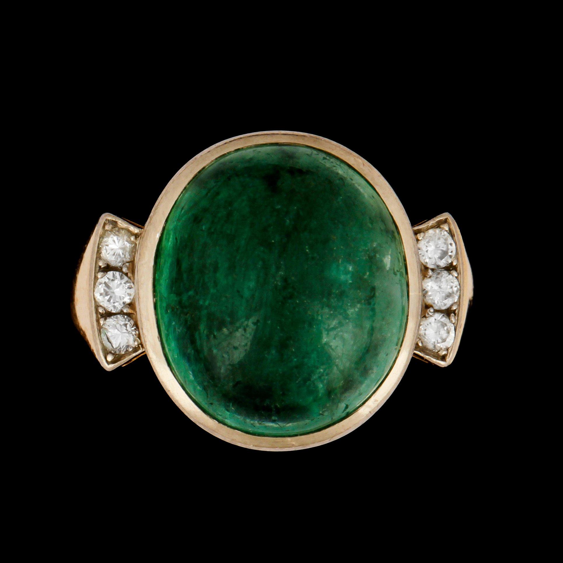 A emerald and brilliant-cut diamond ring.