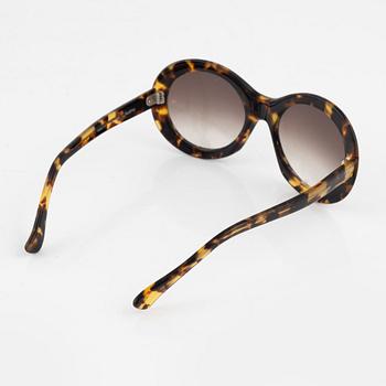 Oliver Goldsmith, a pair of "Audrey" sunglasses.